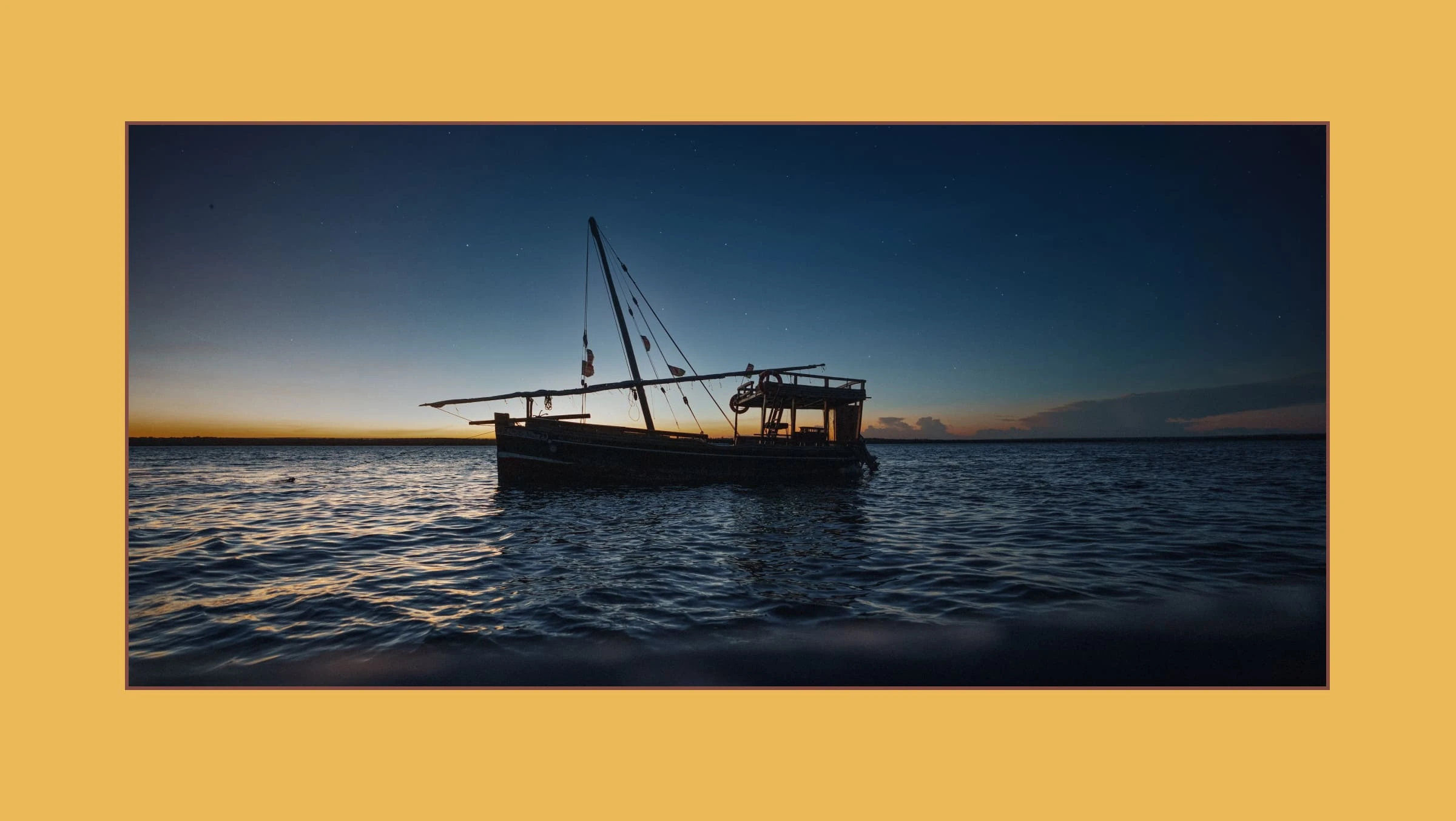 Sailing boat at sunset 