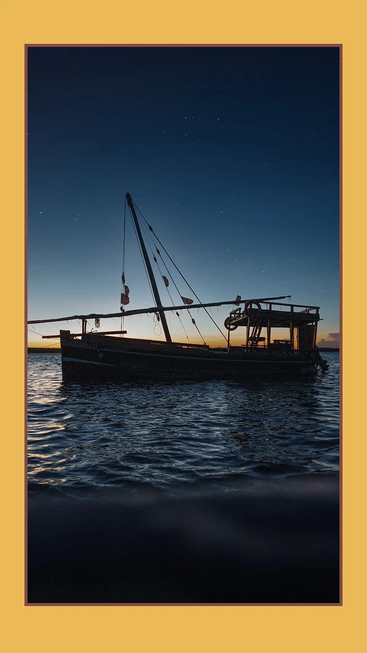 Sailing boat at sunset 