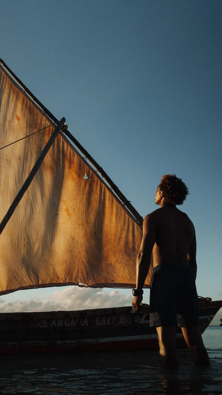 Sailor looking up at boat